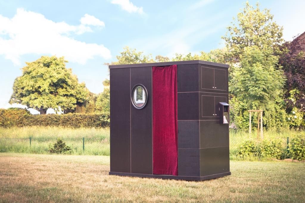Photo booth standing in a grassy meadow