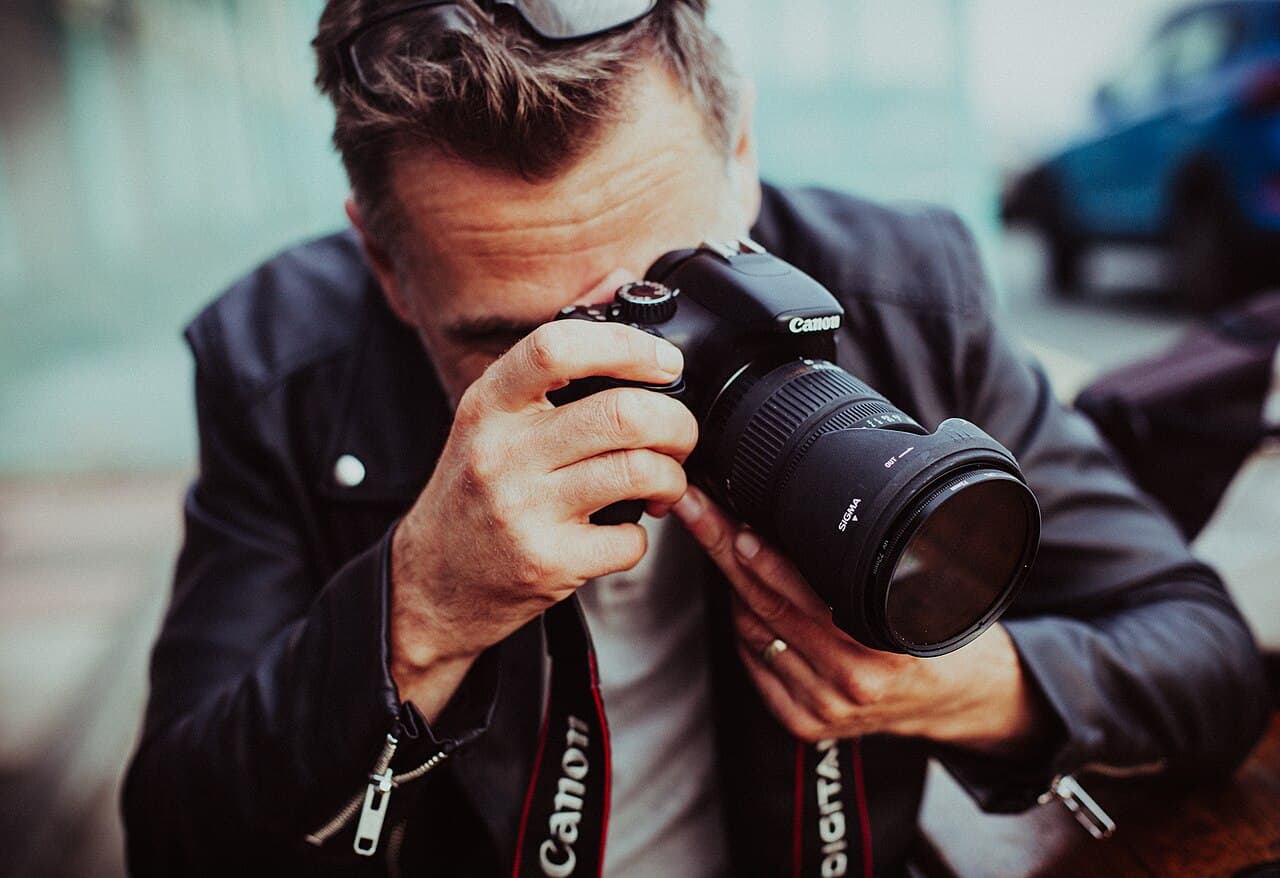 Photographer taking a picture with a camera